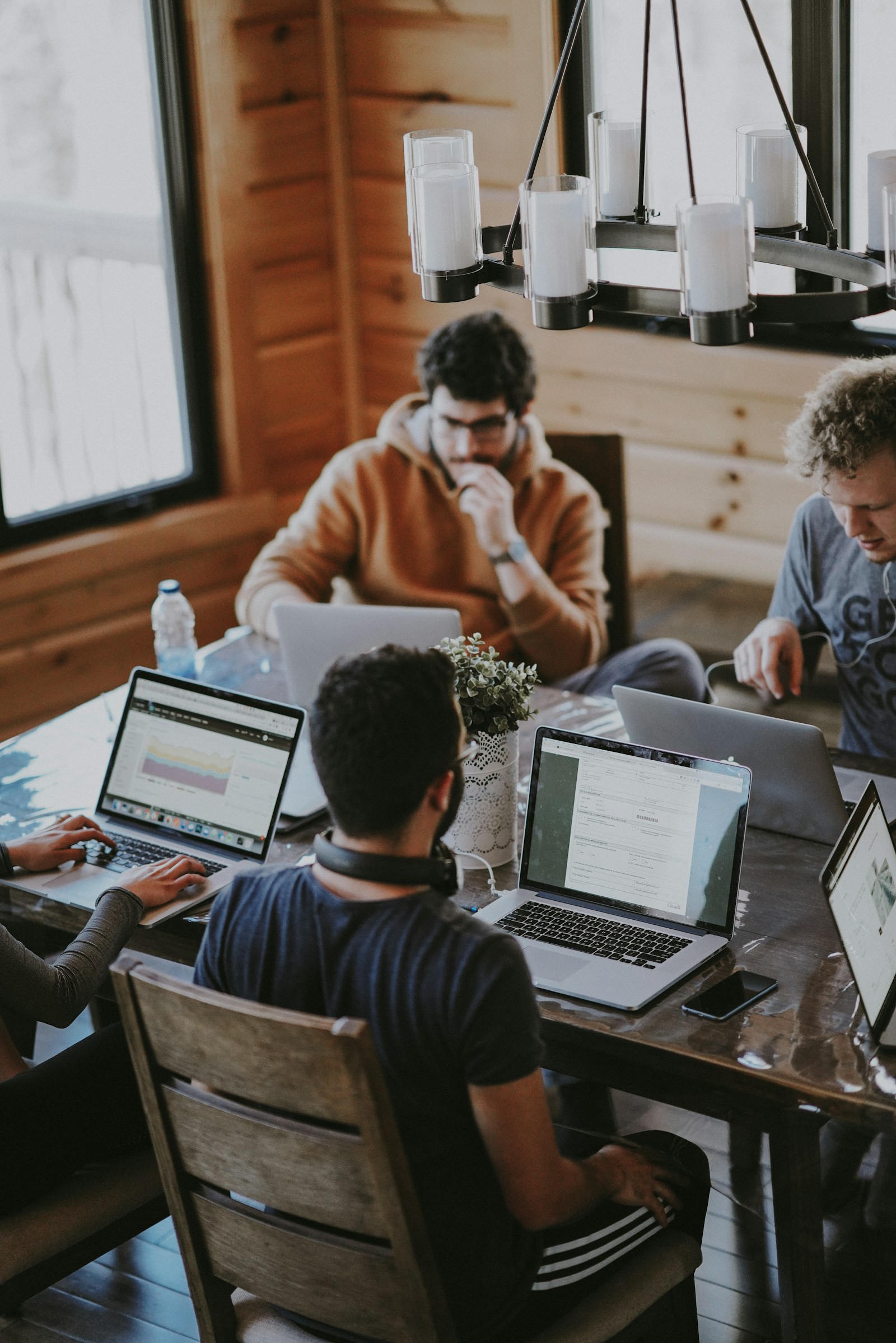 GreenLeap consultants reviewing a hiring brief around a boardroom table