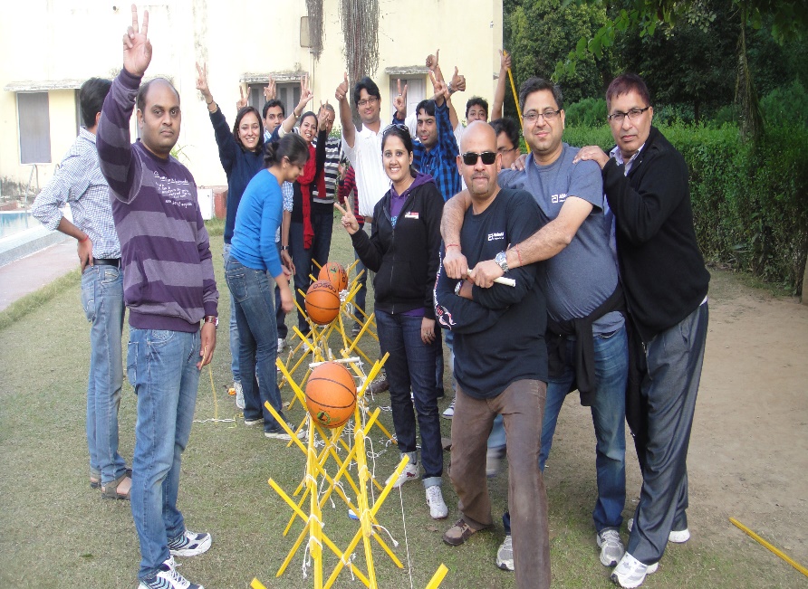 Corporate team completing a collaborative experiential learning challenge